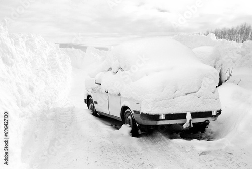 Car covered by a snowdrift