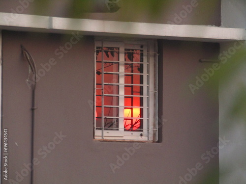 Sun reflection in Glass Window in House Sun set in mirror