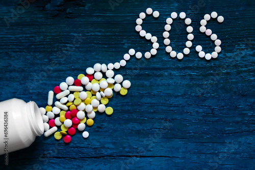 The word SOS is written on tablets
