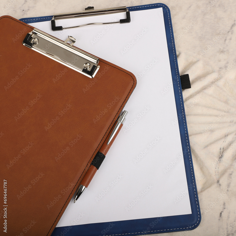 Colorful leather clipboard. Genuine leather clipboard, concept shot, top view, different color, clamshell and stitched clipboard Colorful leather clipboard. Genuine leather clipboard, concept shot, top view, different color, clamshell and stitched clipboard