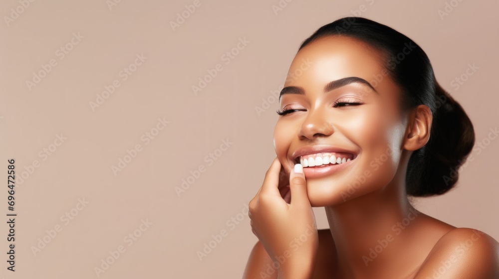 Beautiful smiling young woman with soft glow skin and bare shoulders. Beauty studio portrait with empty space. Beautiful smiling young woman with soft glow skin and bare shoulders. Beauty studio portrait with empty space.