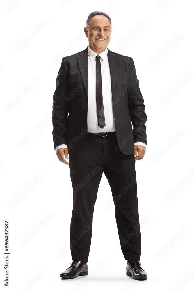 Full length portrait of a cheerful mature businessman smiling Full length portrait of a cheerful mature businessman smiling
