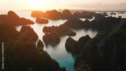 Raja Ampat, Indonesia. Aerial view of the group of islands near the Misool island in West Papua at sunset photo