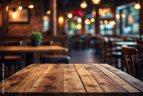 Empty wooden table with blur rustic coffee shop restaurant cafe