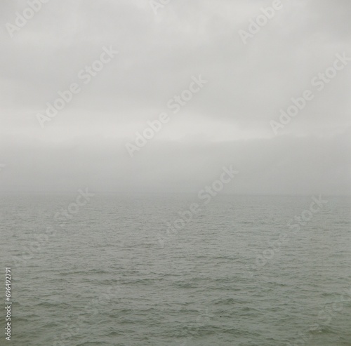 Calm Ocean Panorama with Hazy Horizon