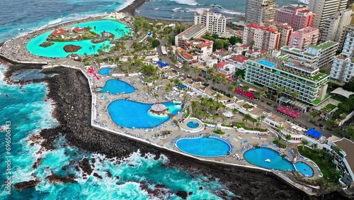 Aerial view of Lago Martiánez swimming pool, resort complex, and luxury hotels in Tenerife. Vacation destination in Puerto de la Cruz on the Canary Islands, Spain with terraces and restaurants. photo