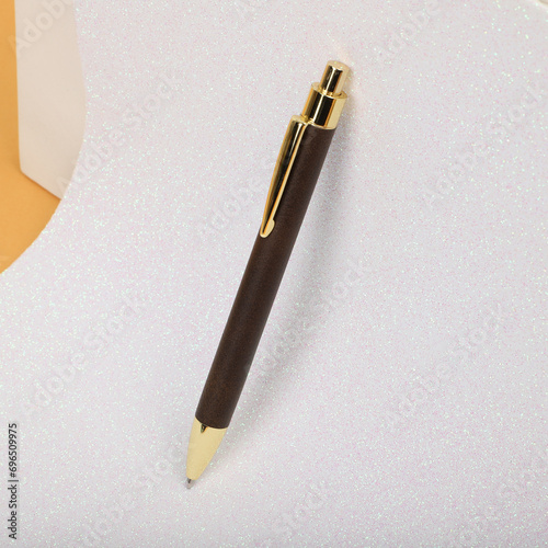 Colorful leather pen. Concept shot, top view, different colors pens. Blank space for text. Special background pen view. Dark brown color pen.