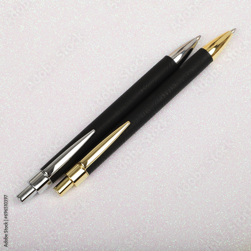 Colorful leather pen. Concept shot, top view, different colors pens. Blank space for text. Special background pen view.