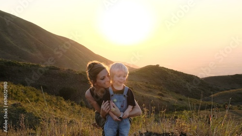 Mom with her little son against the backdrop of beautiful nature.