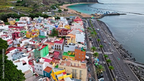 View from above of ships and beaches by the colourful houses on a mountain in San Andrés, Canary Islands. Aerial view of Playa de Las Teresitas and San Andrés village in Tenerife, Spain. photo