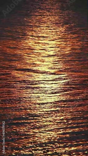 golden hour, golden track of sunlight along the sea water