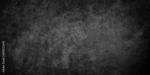dark black grunge textured blackboard or chalkboard, monochrome slate grunge concrete wall or plaster, distressed overlay concrete asphalt texture,  grainy old distressed grunge background in black.