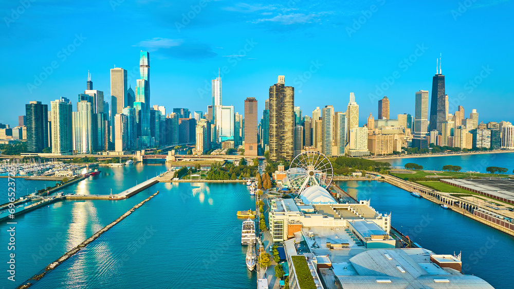 Fototapeta premium Navy Pier on Lake Michigan aerial of Chicago, IL city skyscrapers with sunny dawn