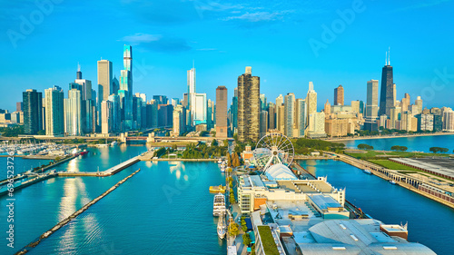 Navy Pier on Lake Michigan aerial of Chicago, IL city skyscrapers with sunny dawn photo