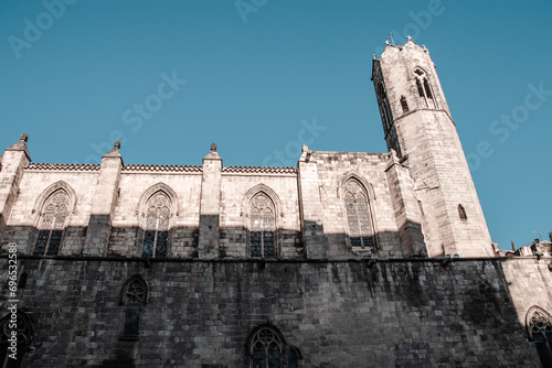 Cityscape photo of the Basilica of Saints Justus and Pastor, Barcelona. Beautiful photography with ornamental side wall. photo