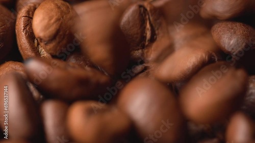 A lot of coffee grains close-up, coffee grains are falling, grains for aromatic coffee photo