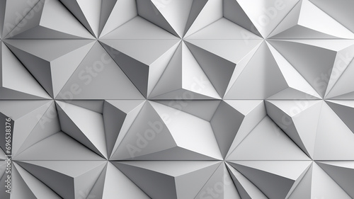 A geometric wall pattern with interlocking triangles in shades of gray and white.