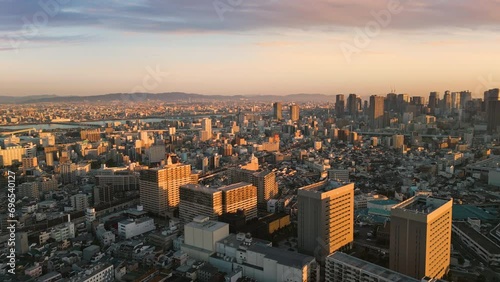osaka city skyline aerial view drone at sunrise umeda ward business and financial district at dawn
