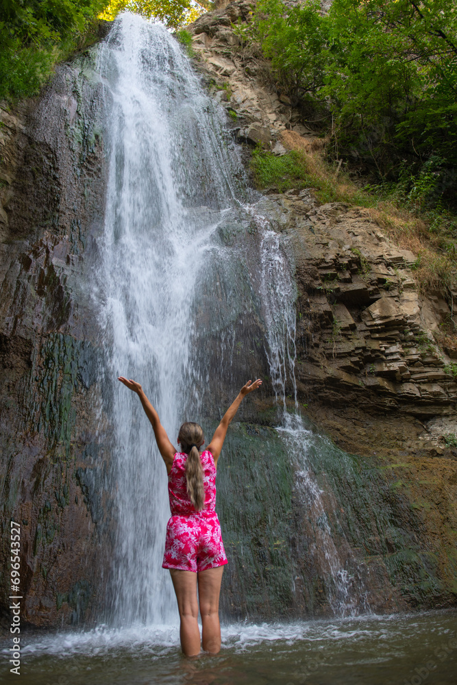 Cascading Dreams: Girl in Red Robes near the Waterfall Cascading Dreams: Girl in Red Robes near the Waterfall