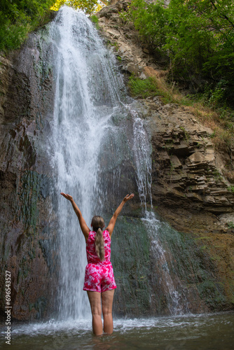 Cascading Dreams  Girl in Red Robes near the Waterfall