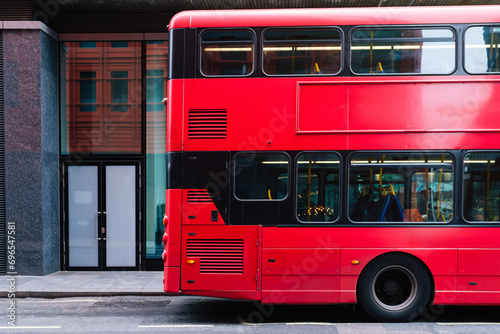Red bus on the streets in London photo