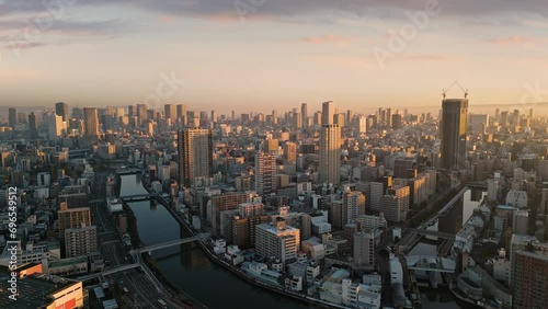 aerial view of osaka city skyline at sunrise dawn minami nishi ward with business financial umeda district in the background