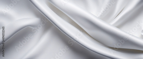 Abstract white background. Crumpled fabric texture. Polypropylene. Wide white banner. The texture of the rough surface of artificial fabric.