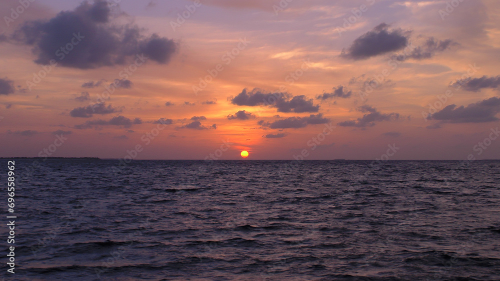 Ocean skyline. Cloudy sunset over the sea.