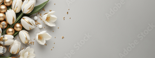 White and gold colored easter eggs and tulips on beige background with copy space. Happy Easter mockup concept