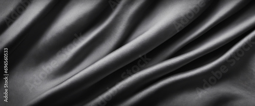 Monochrome crumpled textile. Charcoal creased fabric. Background for design with ample space. Wide panoramic banner.