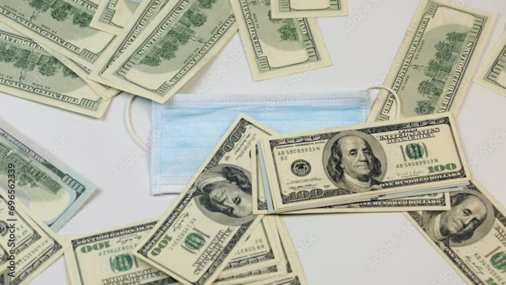 Infectious diseases medical mask and a lot of money on it Infectious diseases medical mask and a lot of money on it