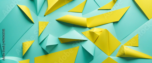 Colorful geometric paper collage with light blue and yellow tones for design. Abstract background with ample copy space. Perfect for web banners.
