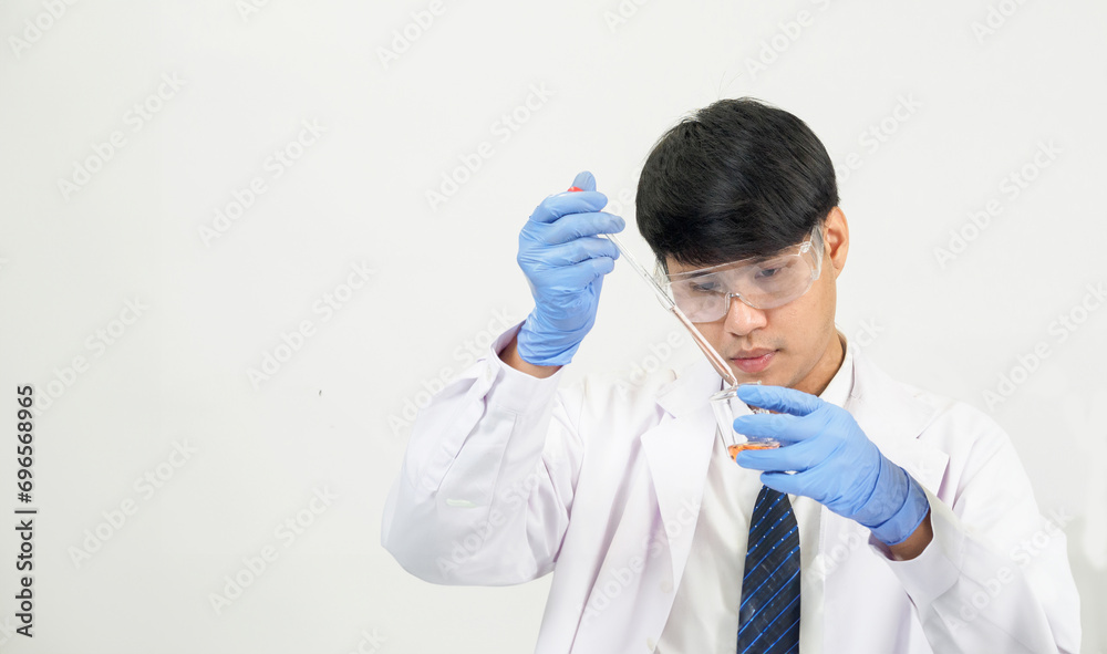 Portrait asian man student scientist or doctor look hand holding reagent mixing laboratory in science research laboratory with test tubes of various size in laboratory chemistry lab white background Portrait asian man student scientist or doctor look hand holding reagent mixing laboratory in science research laboratory with test tubes of various size in laboratory chemistry lab white background