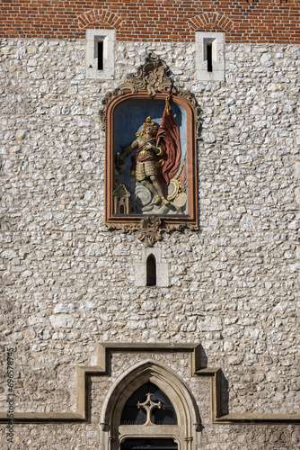 Medieval, gothic Florian Gate, statue of Saint Florian on facade, Krakow, Poland