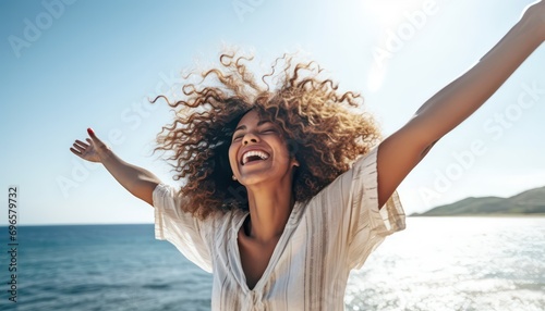 Happy woman with arms outstretched enjoying freedom at the beach , Joyful female having fun walking outside , Healthy lifestyle, happiness and mental health