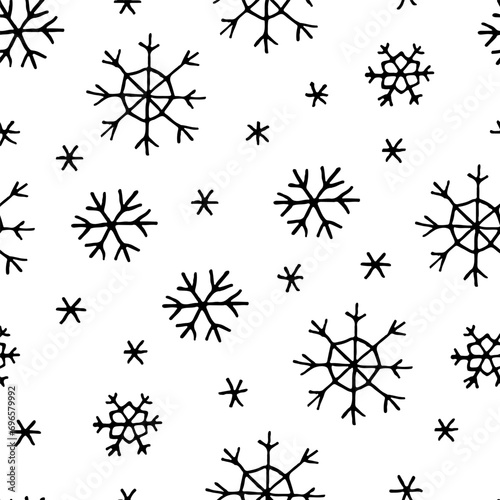 Christmas seamless pattern with doodle snowflakes on white background.