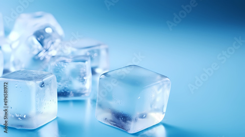 Frozen ice cubes on blue background with copy space