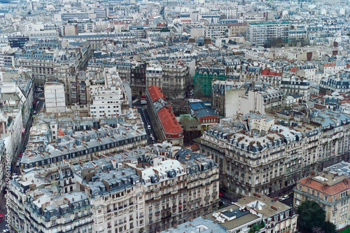 Grainy archival film photograph of historic buildings in Paris France. Photo taken December 1990.  photo