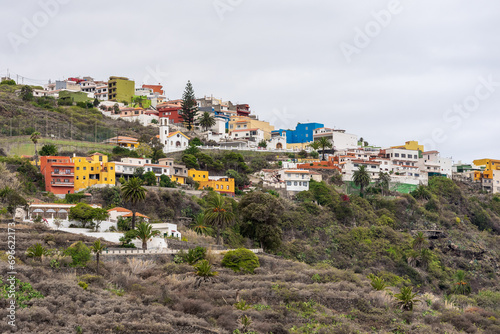 Houses of residents of a seaside town on a hillside. Icod de los Vinos. Tenerife, Canary islands. Spain. photo