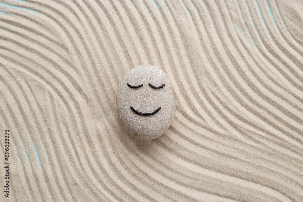 Obraz premium Maditation and relaxation with zen stone calm face. Calmness and harmony background