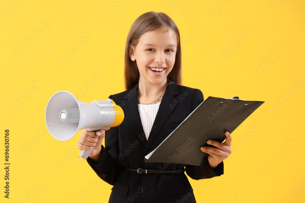 Cute little producer with clipboard and megaphone on yellow background Cute little producer with clipboard and megaphone on yellow background
