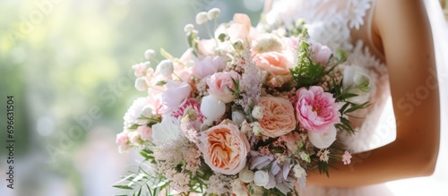 Beautiful summer wedding bouquet. Delicate bright flowers and women wearing wedding dresses