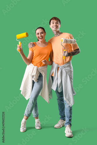 Young couple with paint rol...