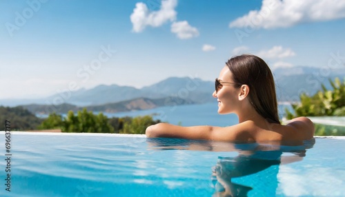 Luxury swimming pool spa resort travel honeymoon destination woman relaxing in infinity pool at hotel nature background summer holiday.  