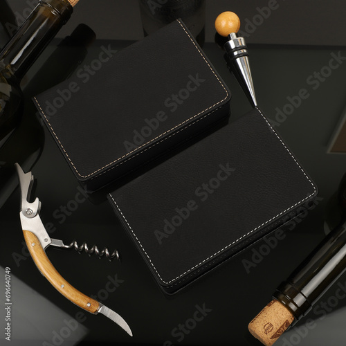 Wine opener set in leather box. Black color leather boxes. Wine opener and cork. Close-up, top view, no people. Concept shot. photo