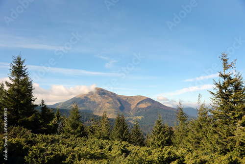 Landscape with Mount Hoverla hanging peak of the Ukrainian Carpathians against the background of the sky and clouds © mehaniq41