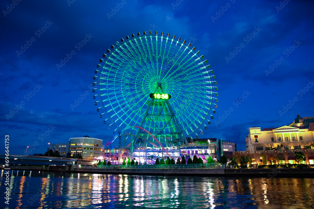 A night illuminated ferris wheel in Yokohama wide shot