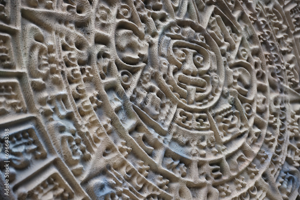 Ancient Mayan Calendar or Aztec calendar with rough relief surface outdoors