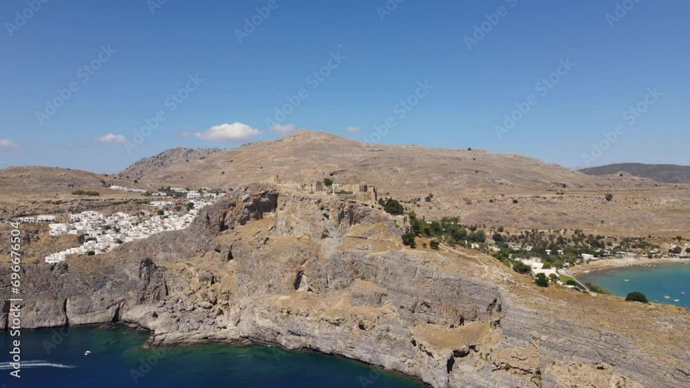 Rotating drone shot of the Acropolis of Lindos on the island of Rhodes, Greece Rotating drone shot of the Acropolis of Lindos on the island of Rhodes, Greece