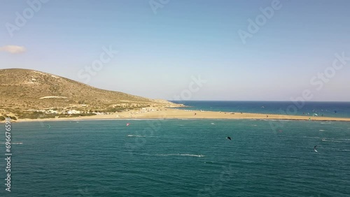 Sideways drone shot of a large group of kite surfers near the coast of Paralia Prasonisiou beach in Rhodes